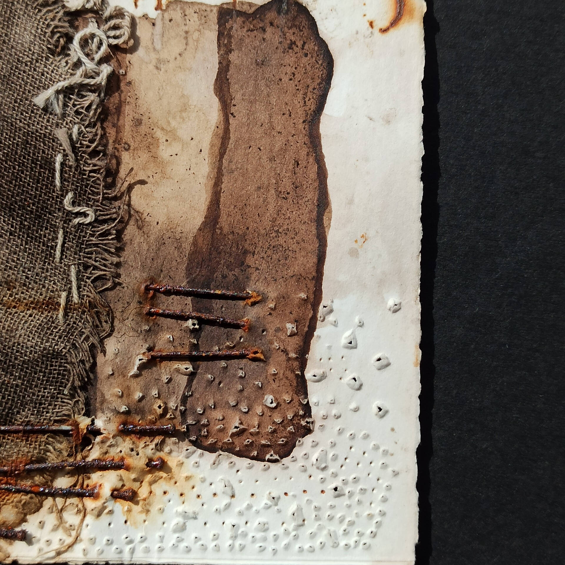 Abstract Image with Burlap Fabric and Rusted Nails